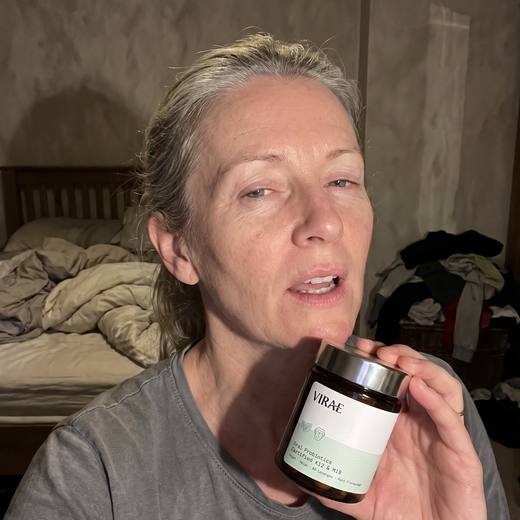 Customer holding the jar in her bedroom