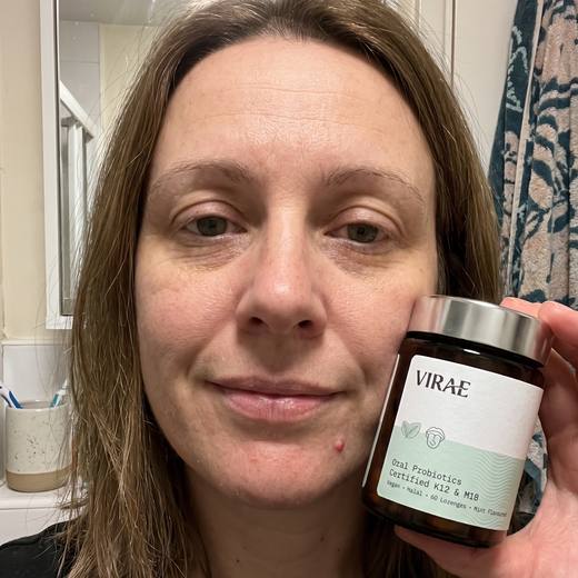 Customer holding the jar in her bathroom