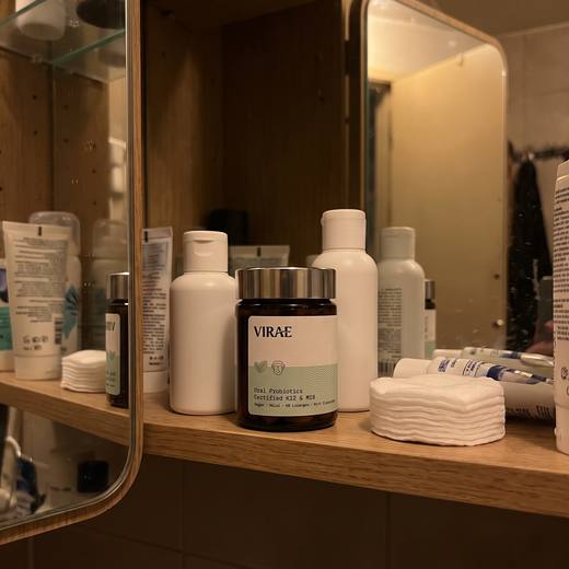 Jar on a bathroom cabinet shelf