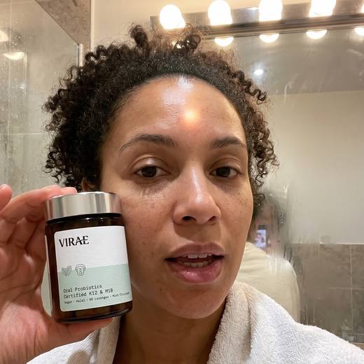 Customer holding the jar in her bathroom